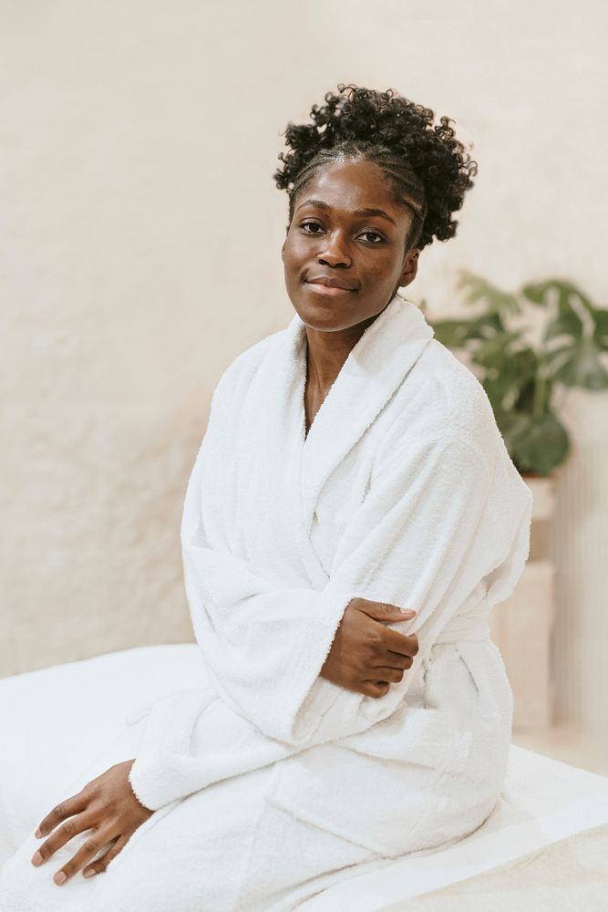 African American woman wearing bathrobe in spa