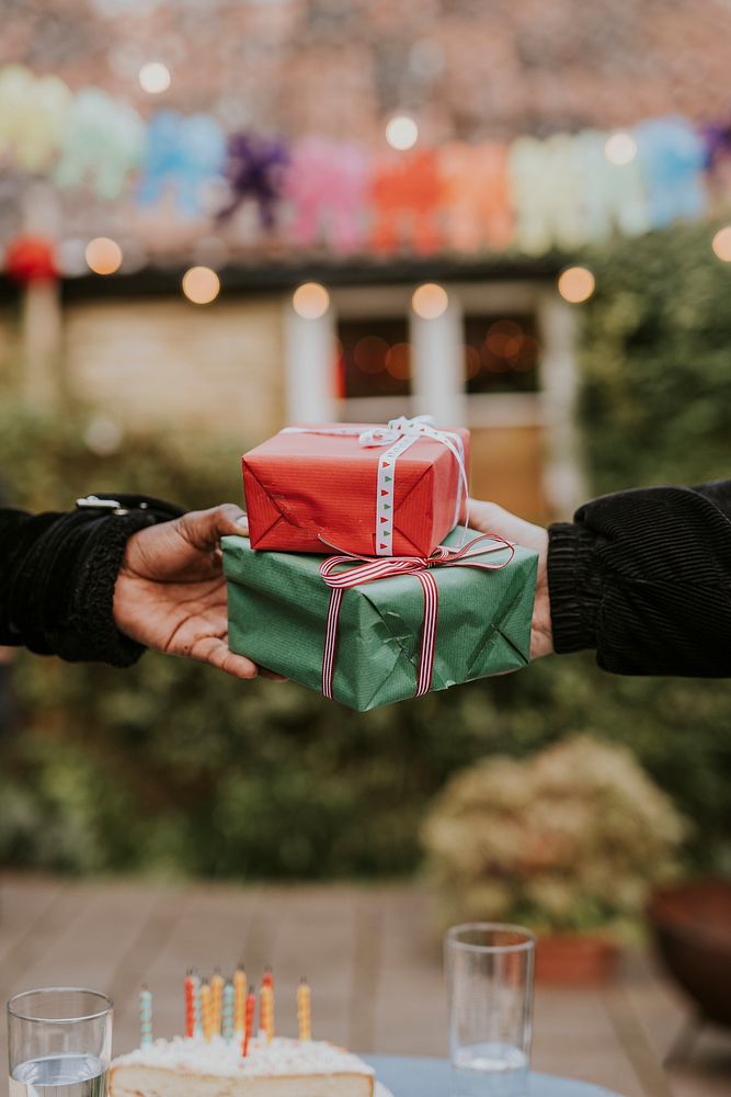 Friends giving gifts at a birthday party 