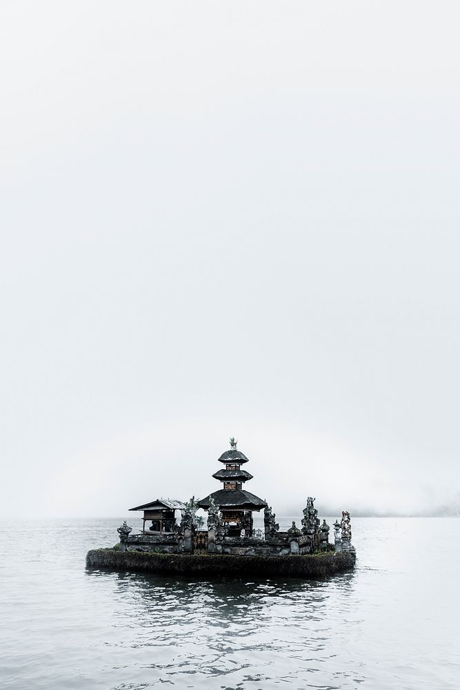 Hindu temple in the mist on a lake in Bali