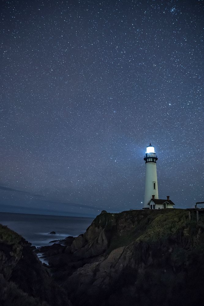 Pigeon Point Light Station with a starry night in San Francisco Bay, California, USA