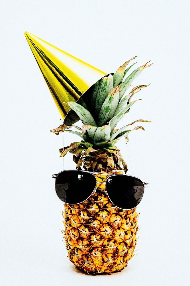 Single festive pineapple with sunglasses