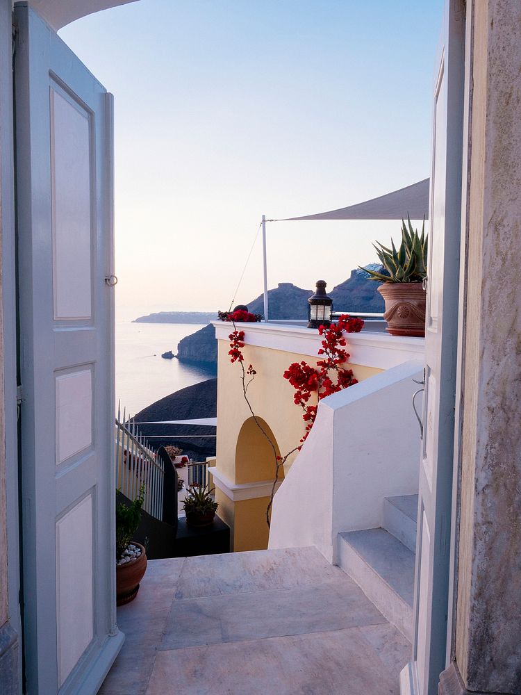 Scenic view of Oia, traditional white painted house, with Aegean sea view in Santorini, Greece