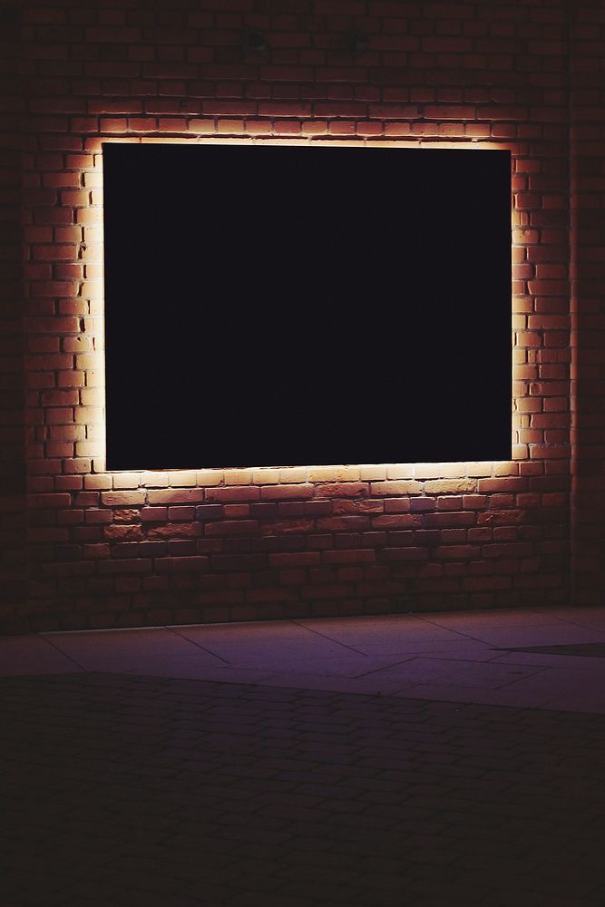 Frame with lighting in a dark room. Visit Kaboompics for more free images.