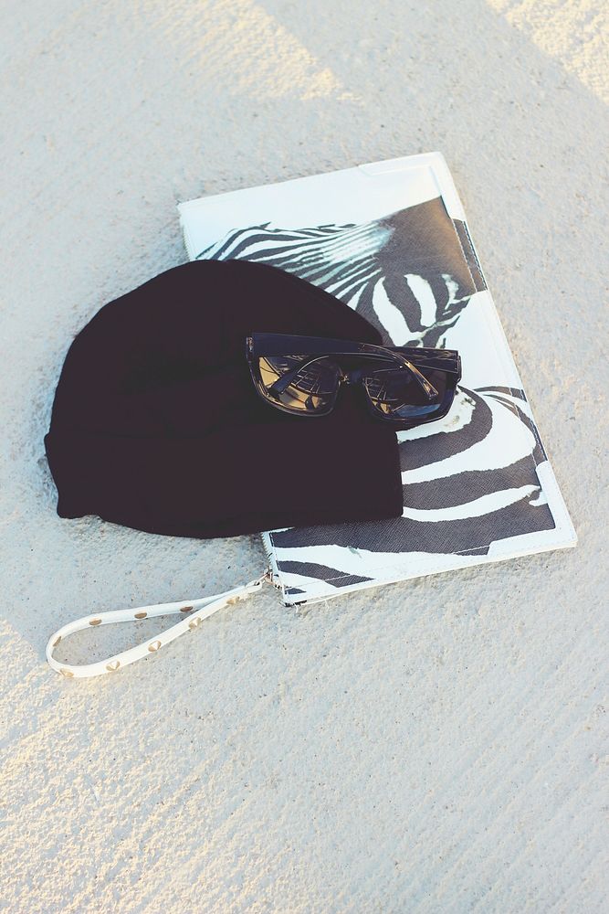 Sunglasses and beanie on the floor. Visit Kaboompics for more free images.