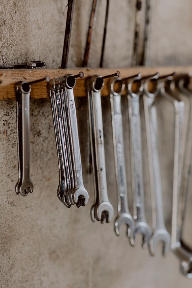 Row of wrenches hanging on a wall. Visit Kaboompics for more free images.