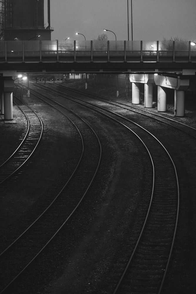 Dark railroad tracks. Visit Kaboompics for more free images.
