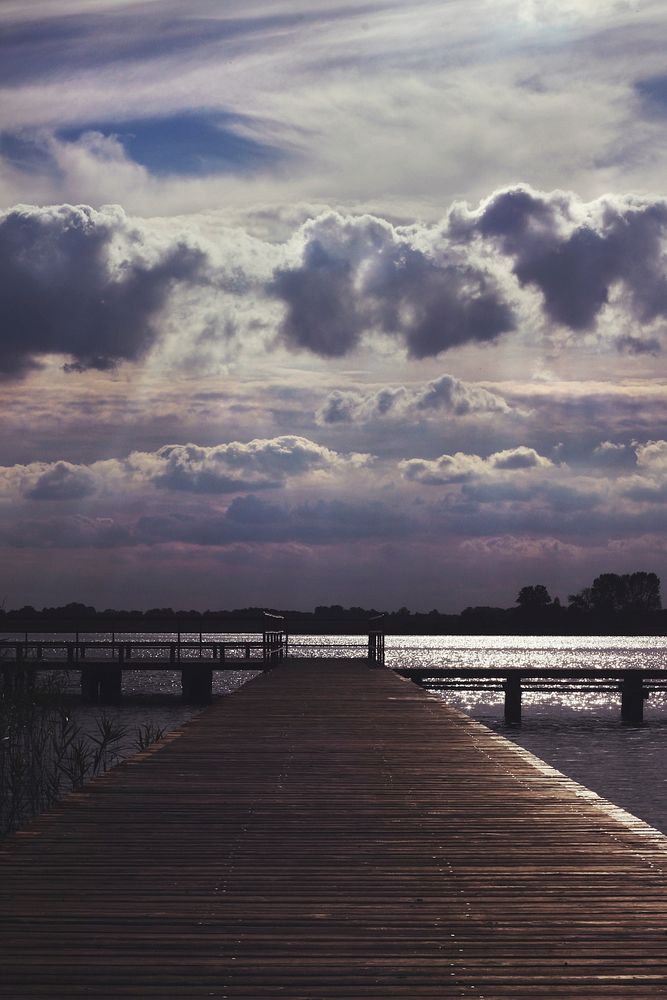 Wooden pier at a lake. Visit Kaboompics for more free images.