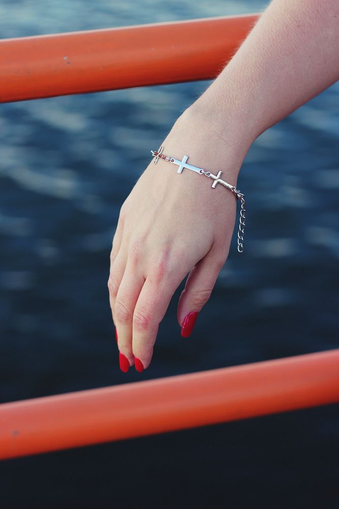 Woman wearing a bracelet. Visit Kaboompics for more free images.