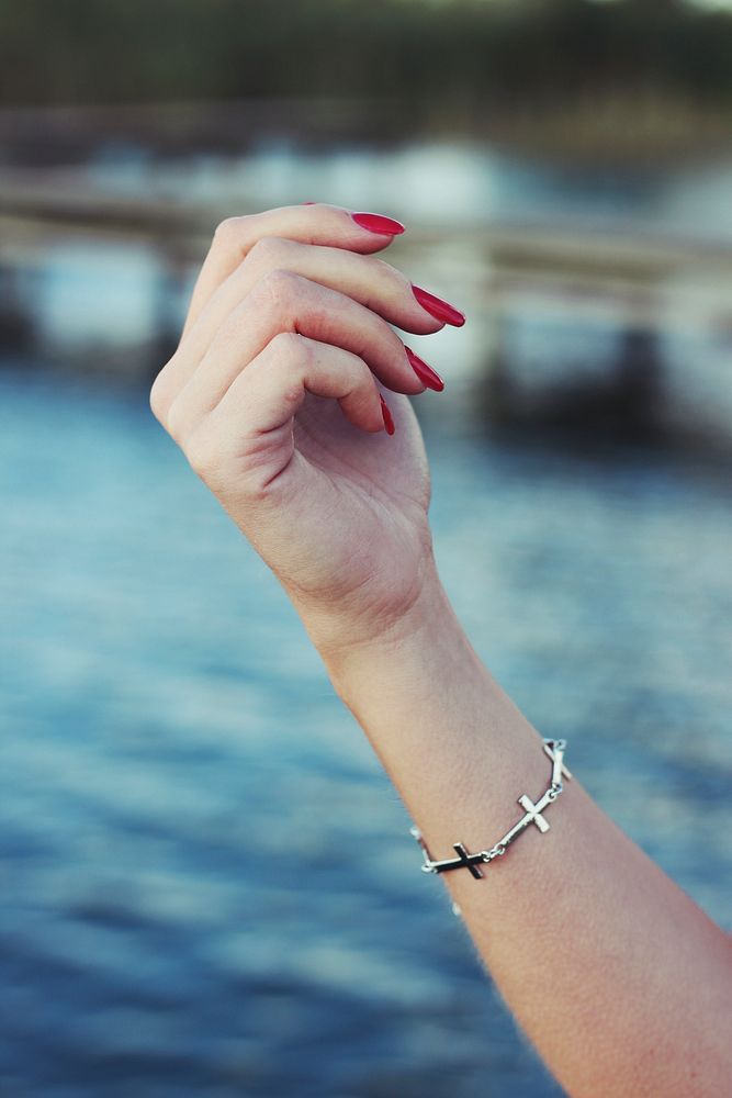 Woman wearing a bracelet. Visit Kaboompics for more free images.