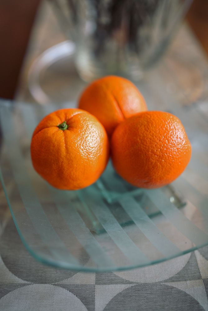 Three resh juicy oranges. Visit Kaboompics for more free images.