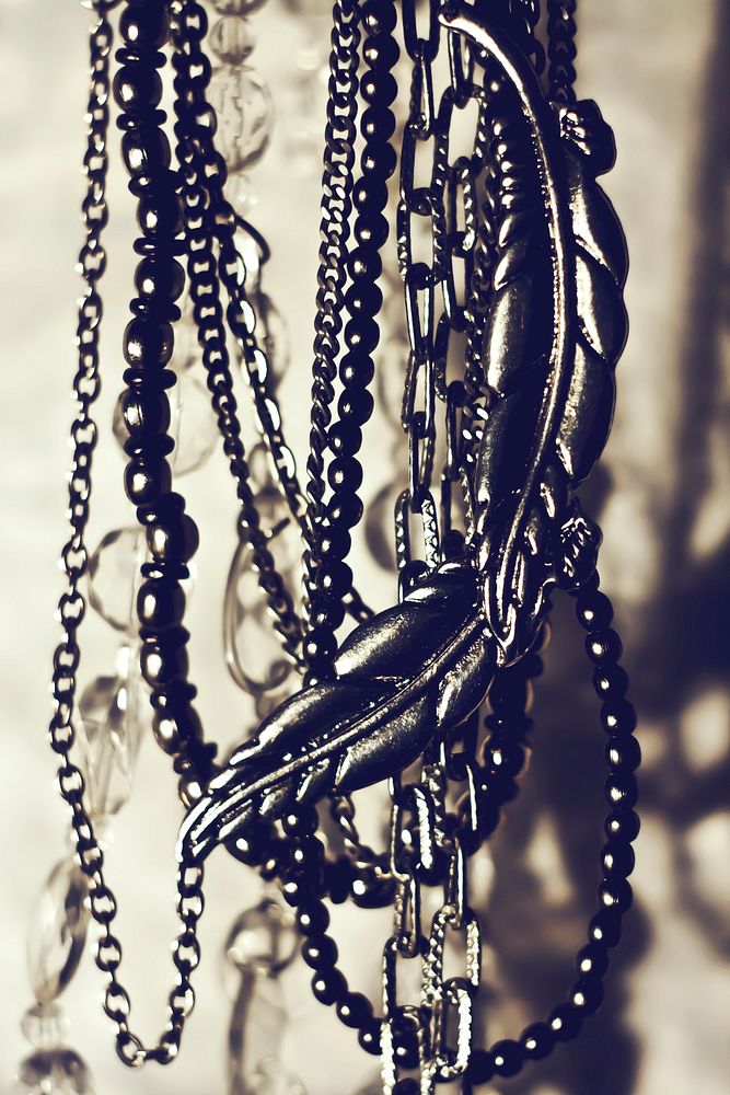 Necklaces hanging on the wall. Visit Kaboompics for more free images.