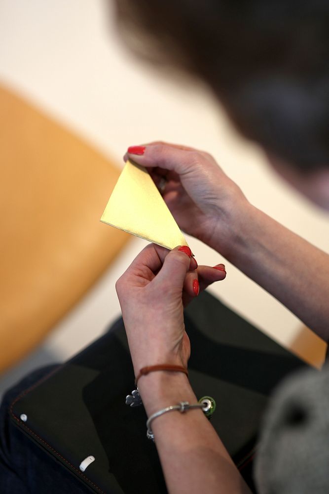 Woman folding origami. Visit Kaboompics for more free images.