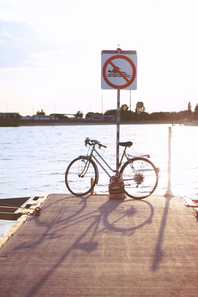 Bicycle parked on a pier. Visit Kaboompics for more free images.