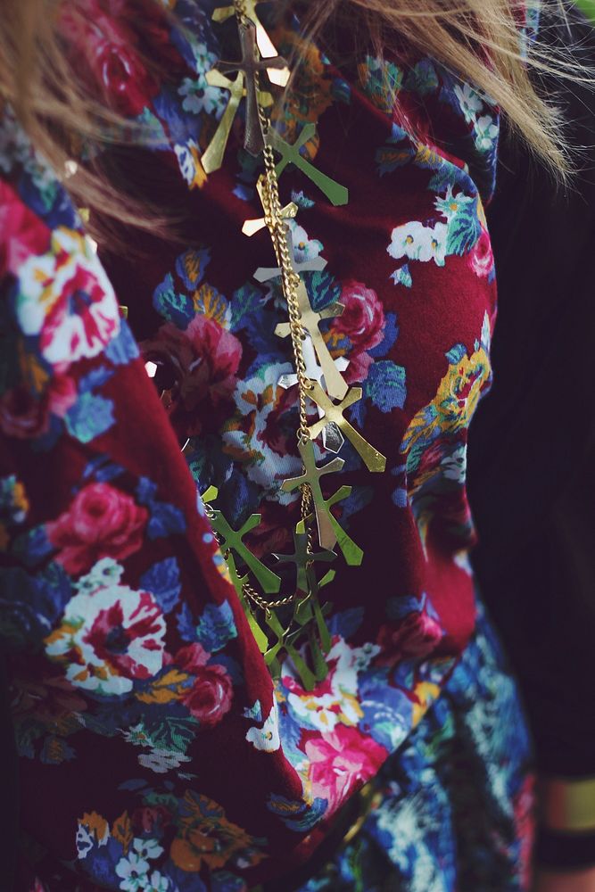 Woman wearing crosses. Visit Kaboompics for more free images.