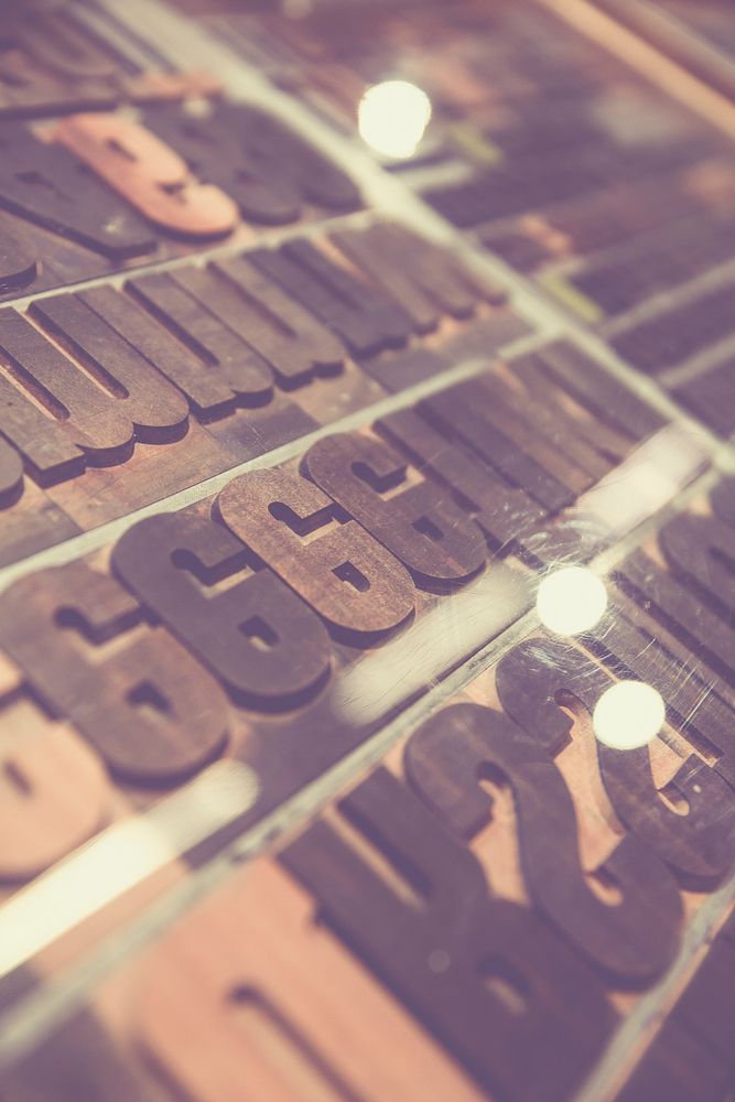 Rows of rusty steel typographic letters
