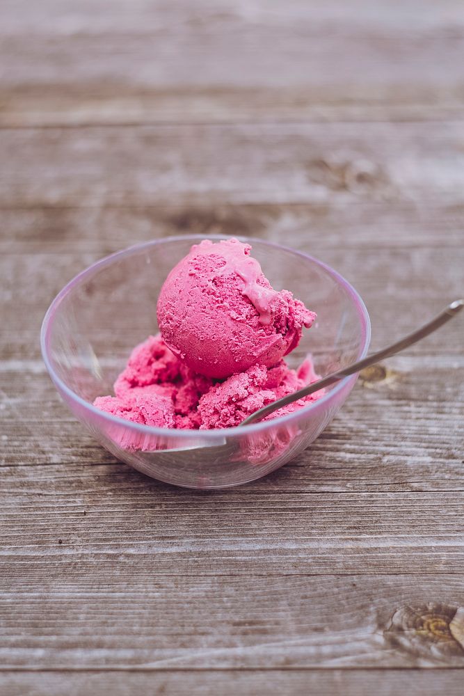 Pink ice cream in a glass bowl