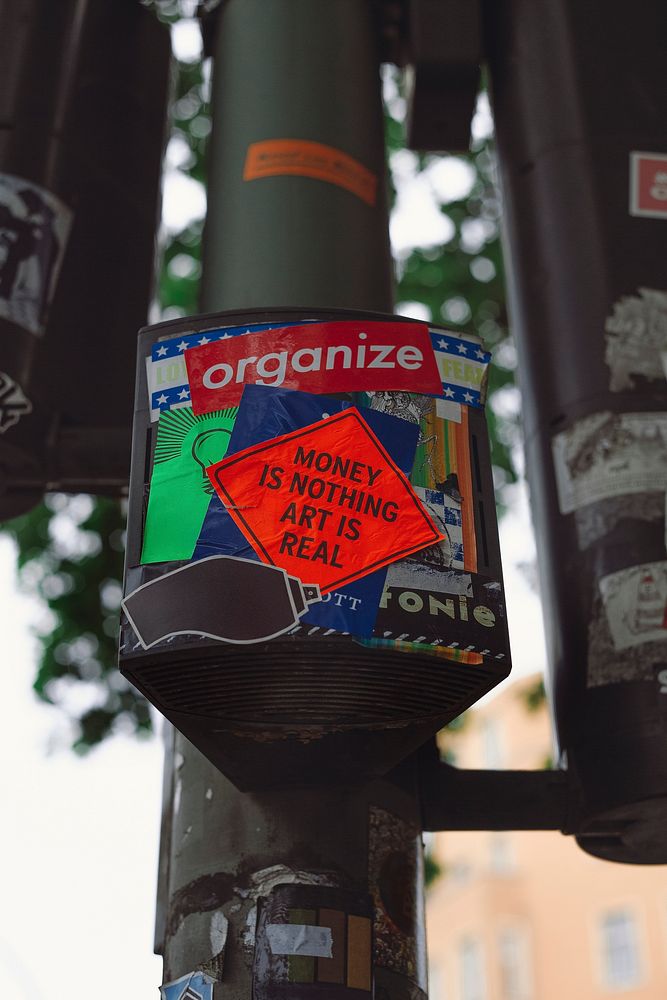 Sticker on a traffic light pole in Berlin, Germany
