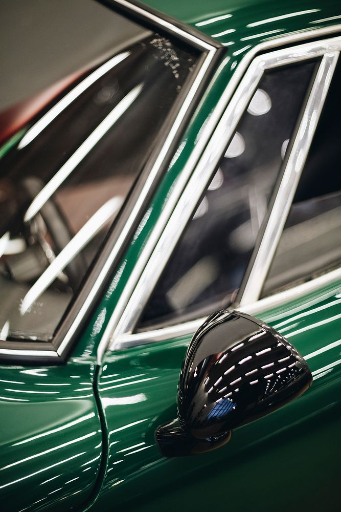 Close up of a green car mirror