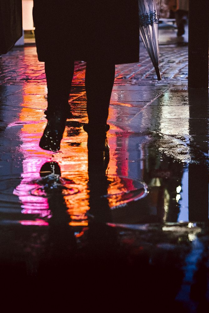 Pedestrians walking in the rain