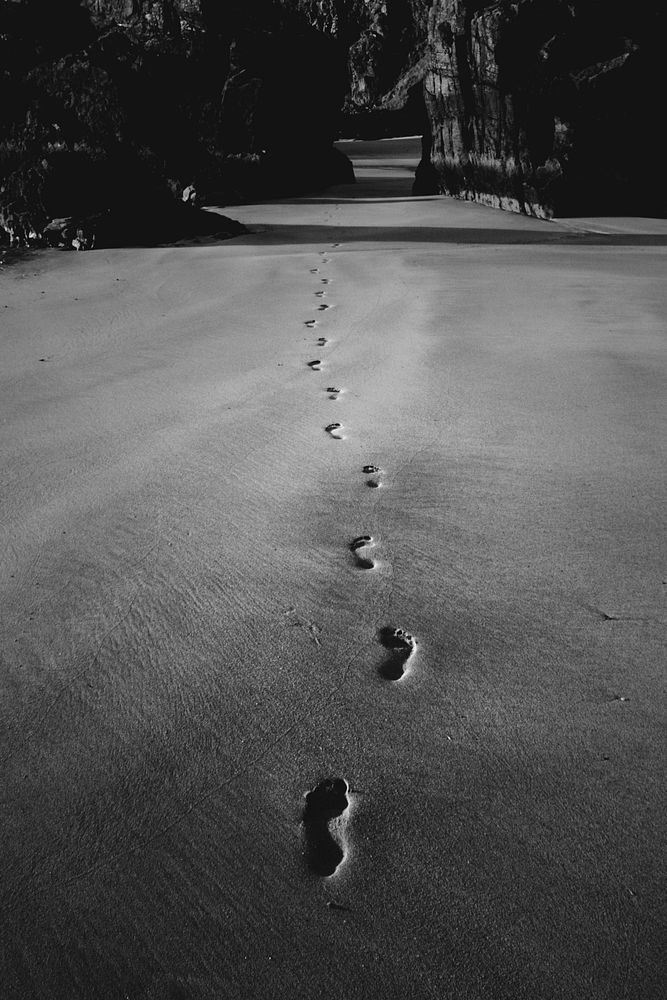 Footsteps on the sand passing through the outer Hebrides island, Scotland