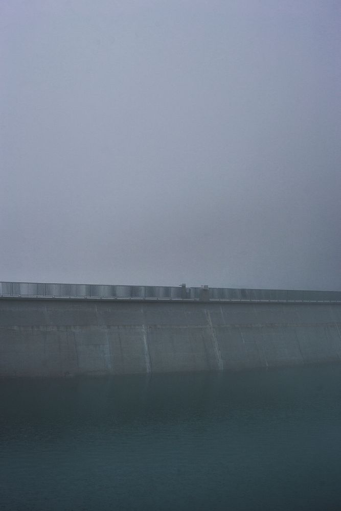 Railing by a foggy dam