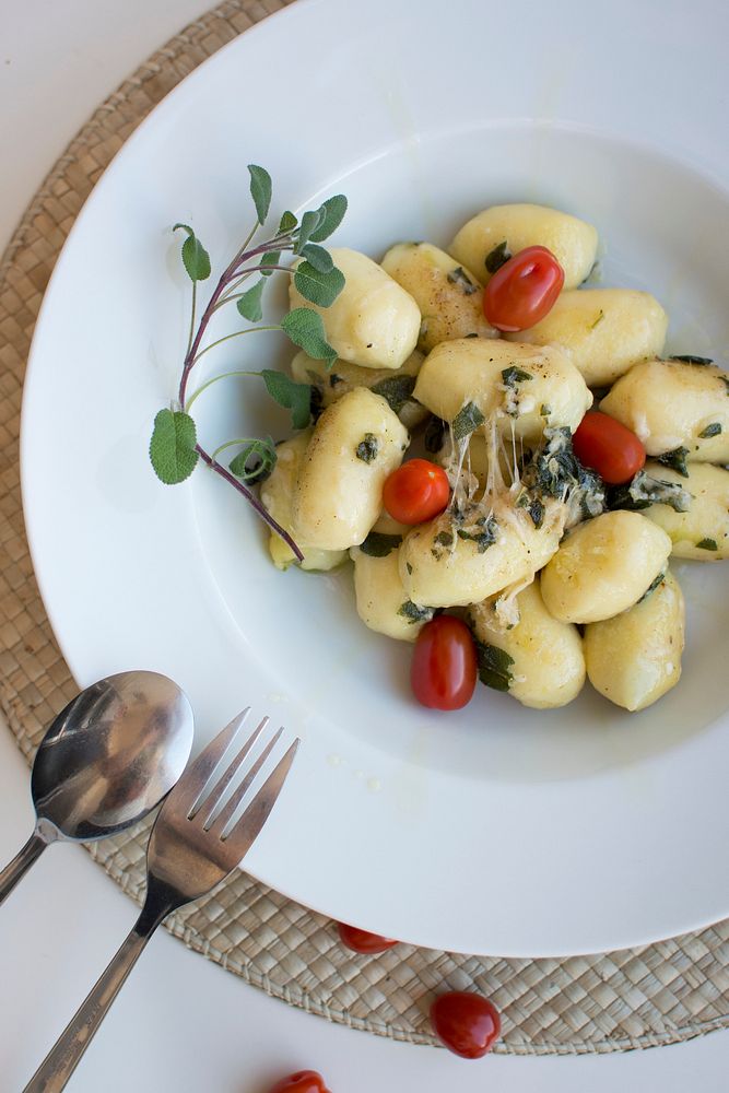 Gnocchi with sage and tomatoes food photography