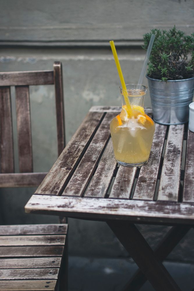 Orange lemonade on a wooden table