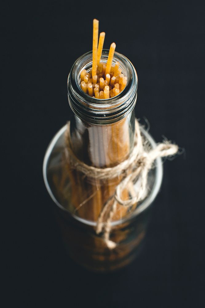 Dried spaghetti in bottle food photography