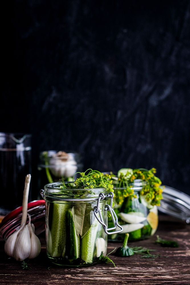Homemade pickled cucumbers in a jar. Visit Monika Grabkowska to see more of her food photography.