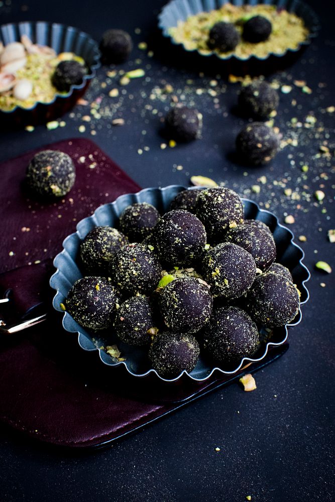 Dark chocolate pralines with pistachios. Visit Monika Grabkowska to see more of her food photography.