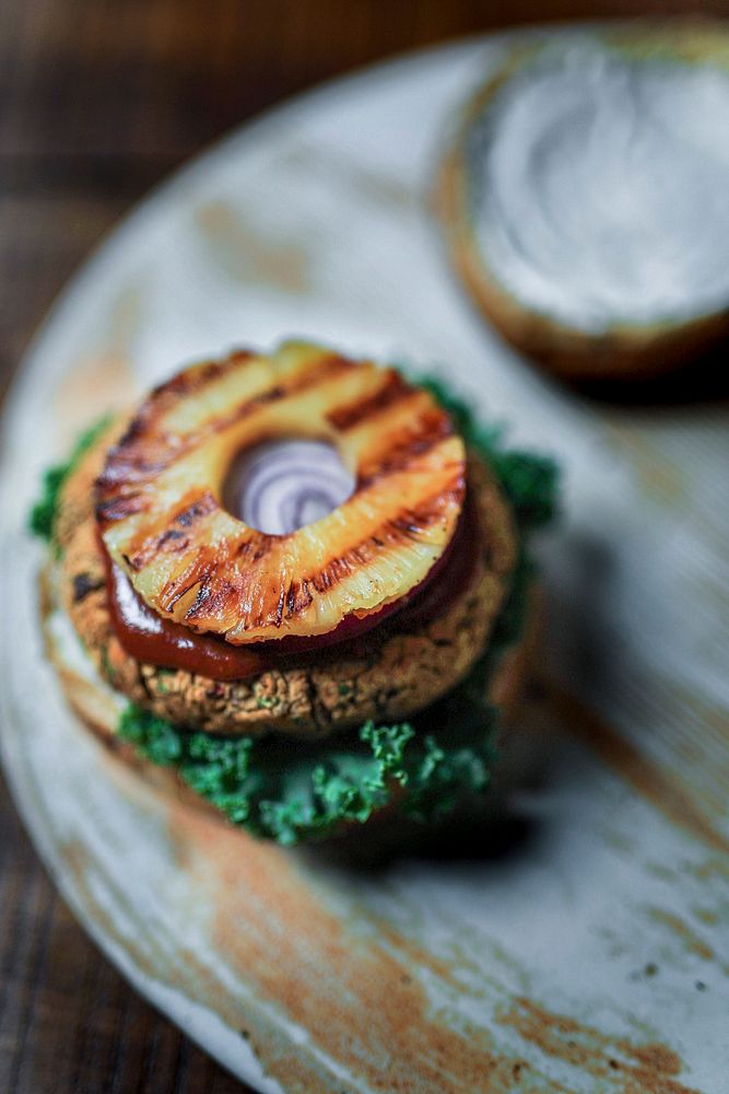 Plant-based burger with fried pineapple on top