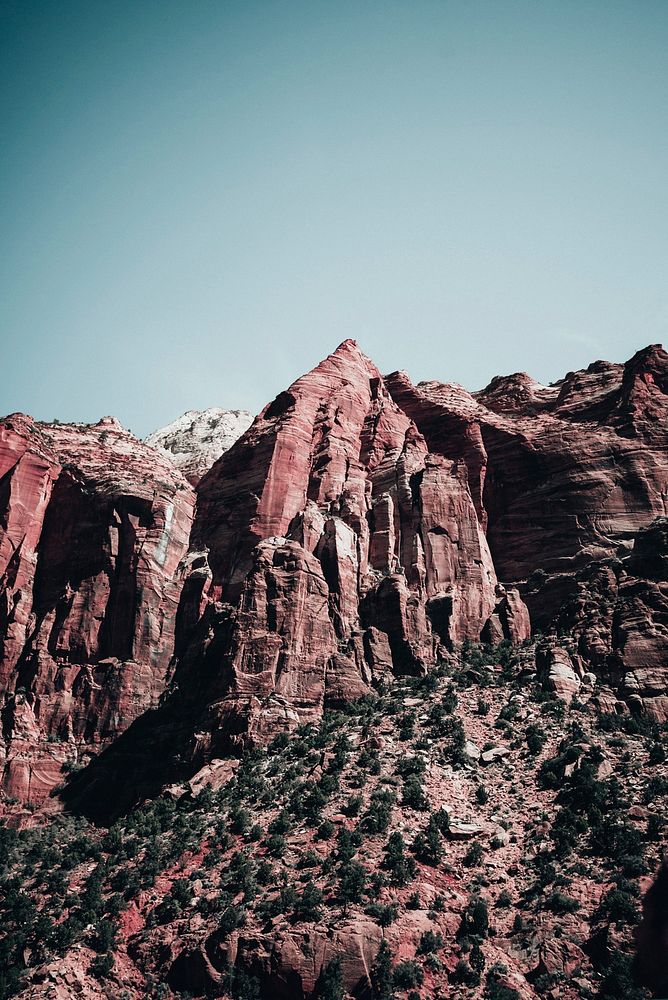 Bright red sandstone peaks in an Arizona canyon.
