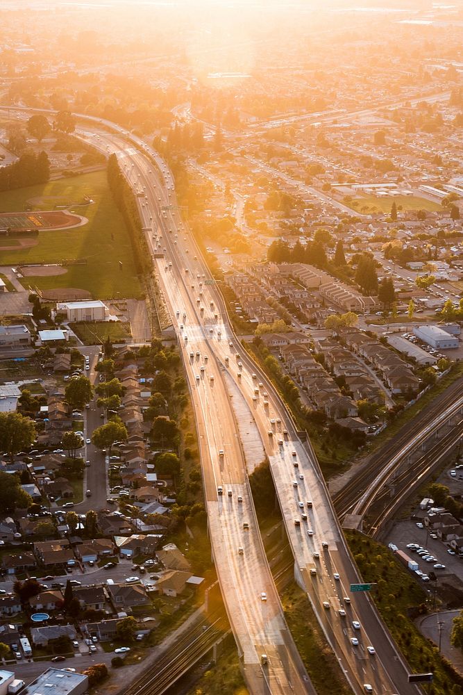 Free aerial view of a city highway through the sunlight public domain CC0 photo.