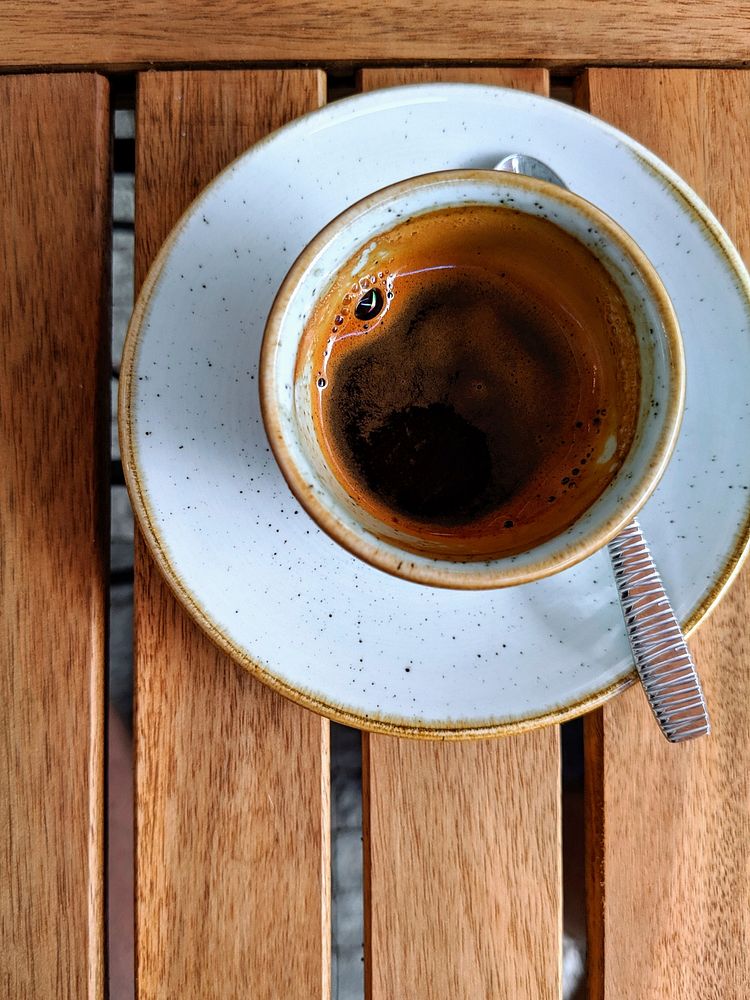 Free espresso cup top view on wooden table photo, public domain beverage CC0 image.