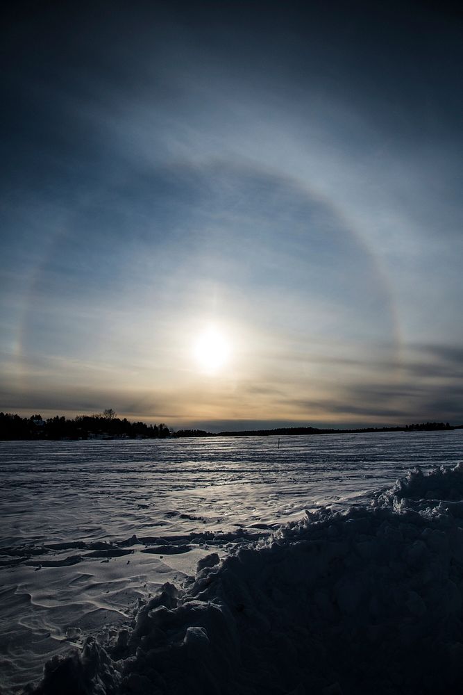A 22-degree halo around the sun is seen as it sets on the frozen Shagawa Lake, Ely, MN on March.