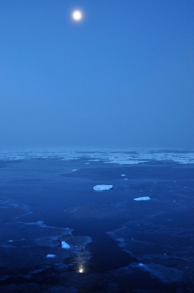 Arctic Moon. The moon hovers above the Arctic Ocean horizon Sept. 10, 2009.Photo Credit: Patrick Kelley, U.S. Coast Guard.…