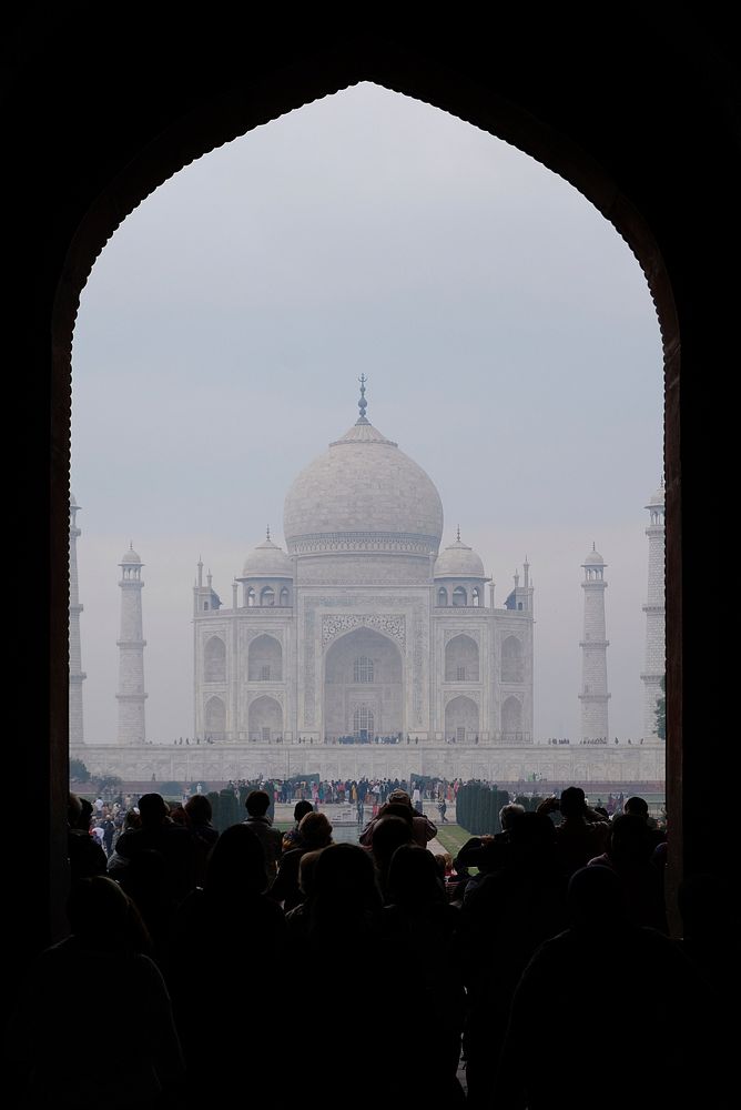 Taj Mahal through arched door. Free public domain CC0 photo.