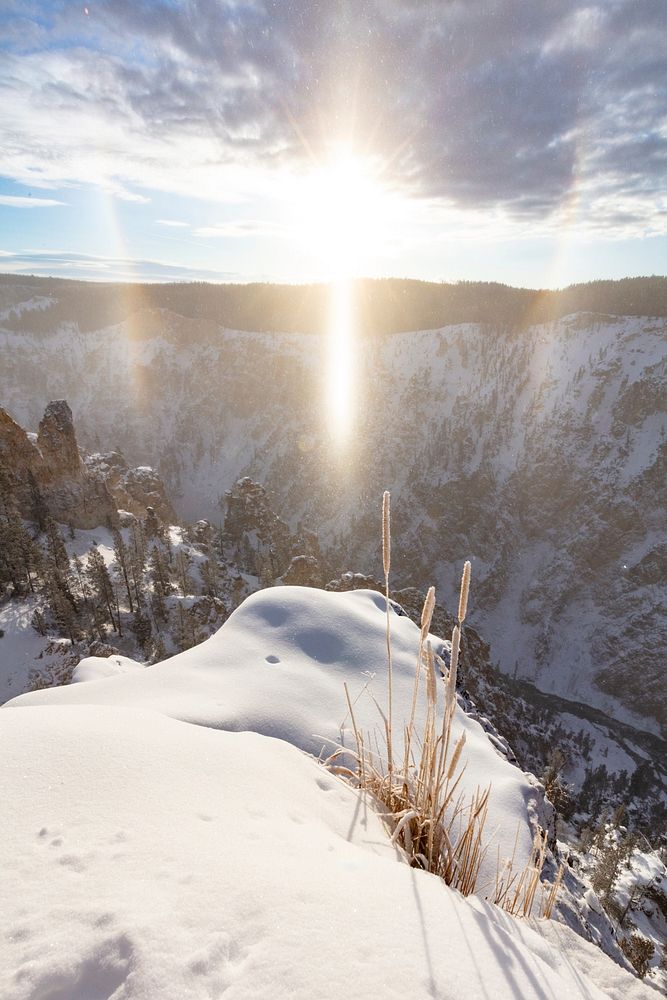 Sun dog over the Grand Canyon of the Yellowstone (portrait) by Jacob W. Frank. Original public domain image from Flickr