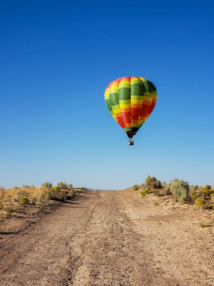 hot air balloon preparing to land in Rio Rancho