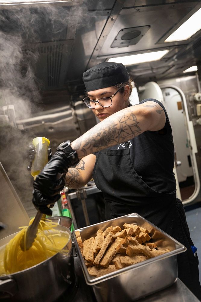 ATLANTIC OCEAN (April 8, 2021) Culinary Specialist 2nd Class Jasmine Santiago cooks spaghetti aboard the Arleigh Burke-class…