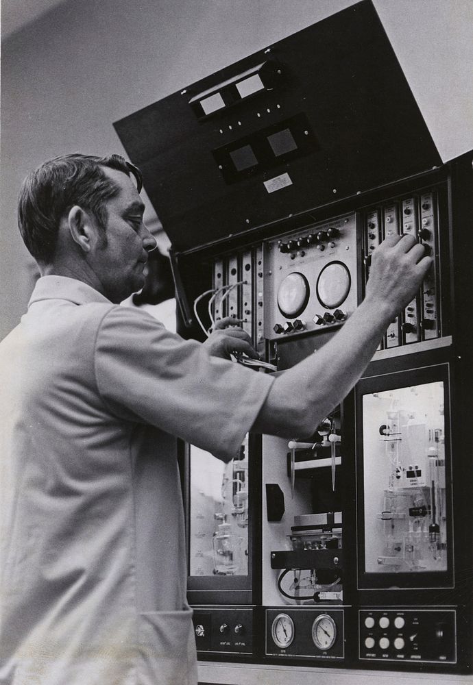 Blood tester - A machine capable of completing a blood test in 20 seconds is adjusted by Hospitalman 1st Class Don Elam…