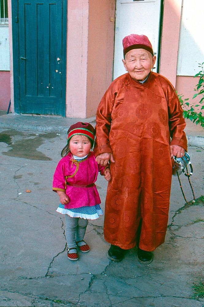 A Mongolian elder and his granddaughter pose for a picture. Original public domain image from Flickr