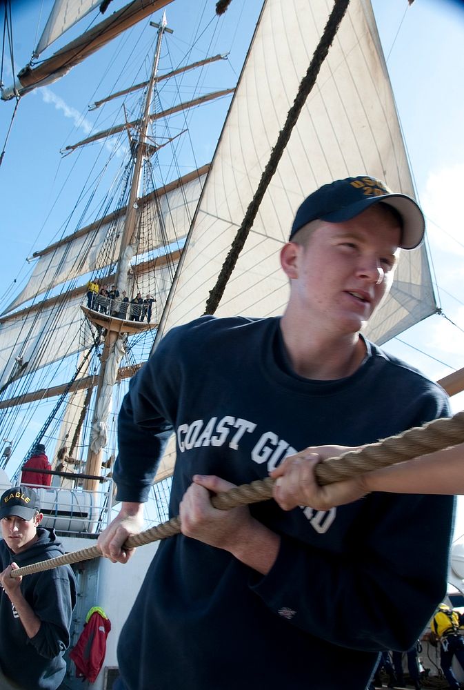 Coast Guard Third Class Cadet Boone Swanberg hauls a line while aboard the Coast Guard Cutter Eagle Wednesday, June 22…