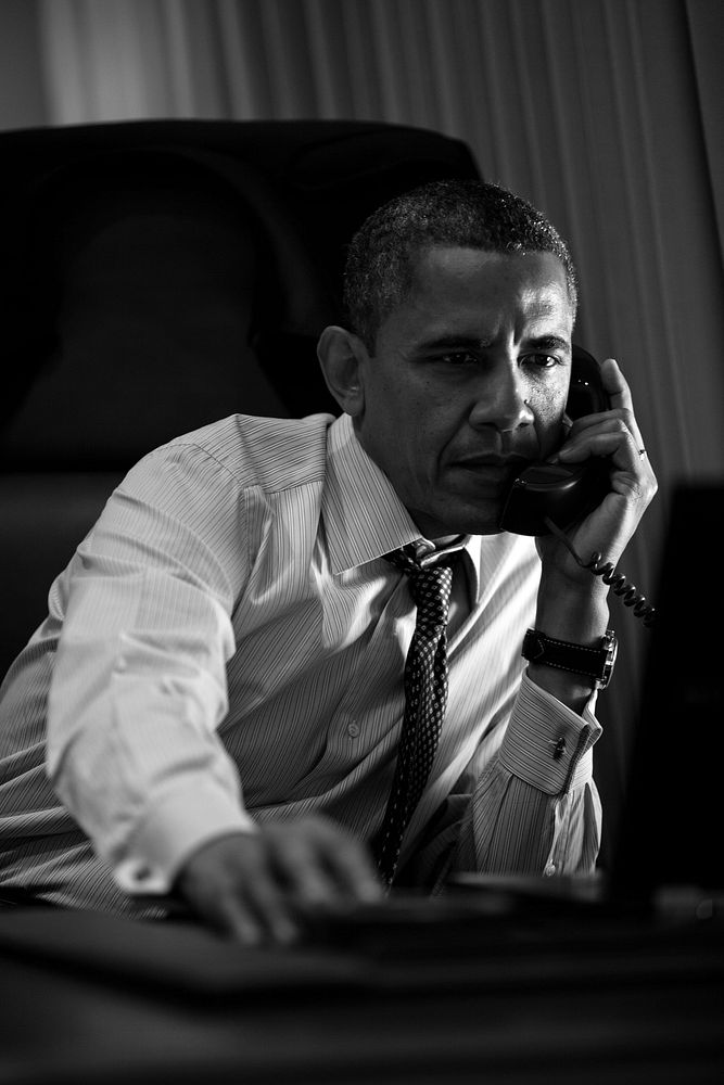 President Barack Obama talks on the phone with Prime Minister Mario Monti of Italy aboard Air Force One, June 6, 2012.