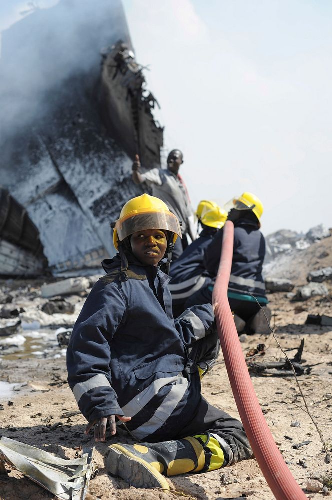 AMISOM firefighters attempt to stop the fire at the site of an airplane crash in Mogadishu, Somalia, on August 9. An…