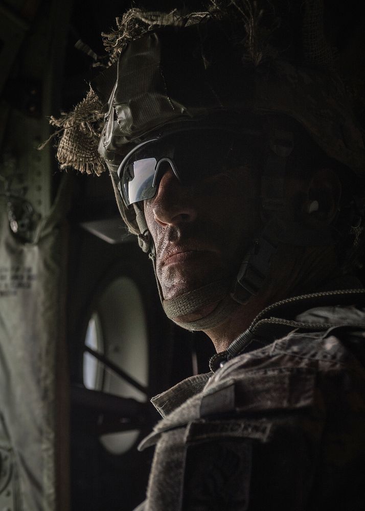 A U.S. Army paratrooper waits inside an Air Force C-130J Super Hercules aircraft assigned to the 37th Airlift Squadron…