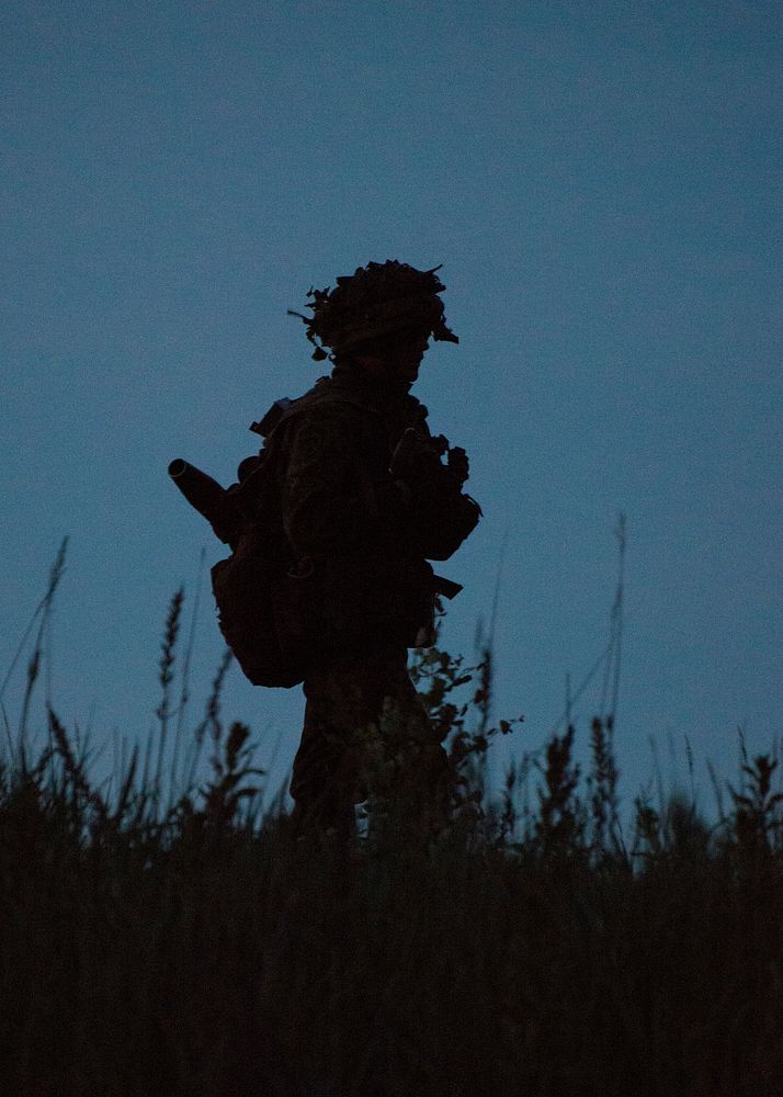 A Norwegian soldier makes his way to a tree line during a multinational field training exercise that demonstrated the…