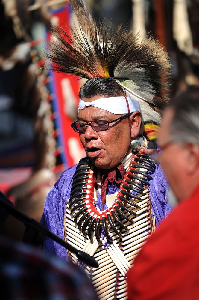 David Patterson, Sac and Fox tribe member, from Long Beach California, beats the Southern drums during the Gourd dance…