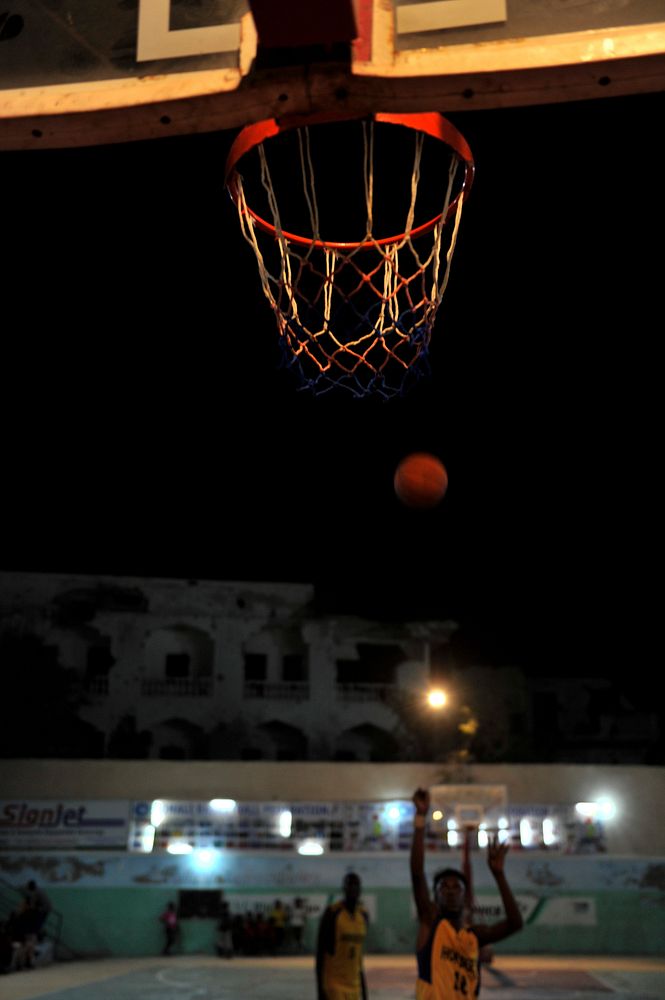 A Horseed basketball player tries to score a basket during their game against Heegan in Abdiaziz district of Mogadishu…