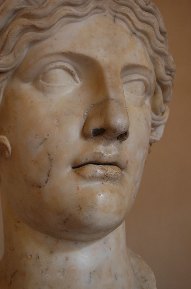 Roman woman sculpture, Greek architecture. Original public domain image from Flickr